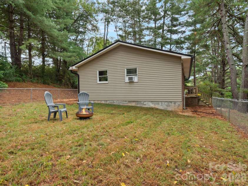 305 Youngs Cove Road, Candler, NC 28715.  MLS# CAR4427109, YatesRealty ID 53775. Side Yard