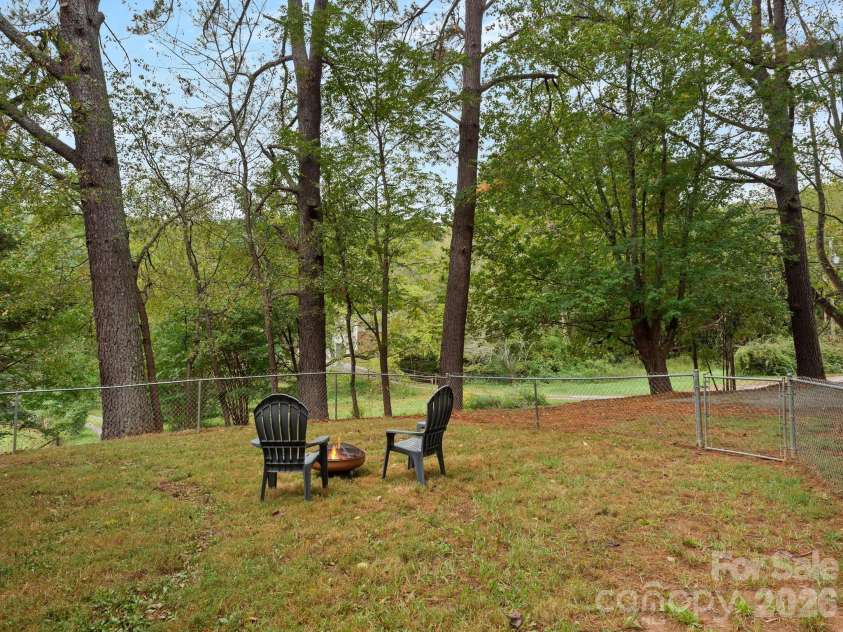305 Youngs Cove Road, Candler, NC 28715.  MLS# CAR4427109, YatesRealty ID 53775. Side Yard