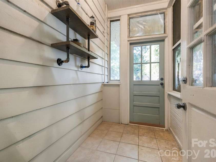 407 South Street, Gastonia, NC 28052.  MLS# CAR4429534, YatesRealty ID 53777. Mudroom leading to back yard