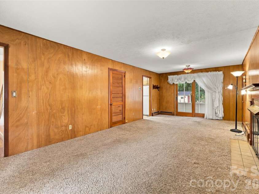 1641 Camelot Drive, Hendersonville, NC 28739.  MLS# CAR4418926, YatesRealty ID 53780. Large Den with Fireplace