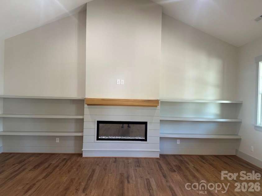113 Todd Drive, Concord, NC 28025.  MLS# CAR4423232, YatesRealty ID 53783. Built in book shelves surround fireplace