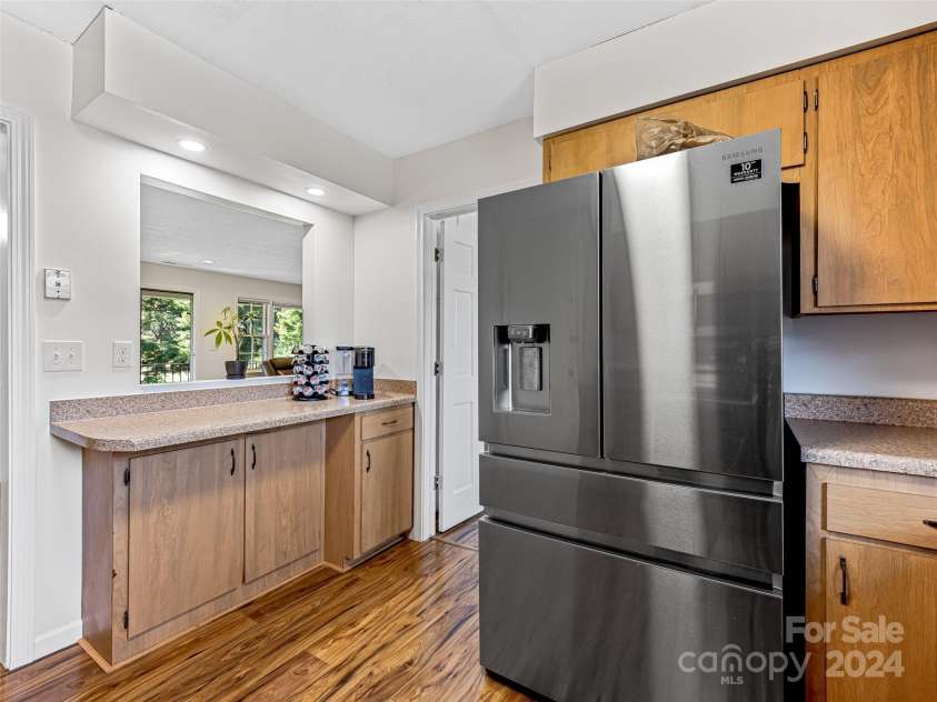 410 Golf View Lane, Hendersonville, NC 28739.  MLS# CAR4185959, YatesRealty ID 5379. Kitchen looking into Living Area