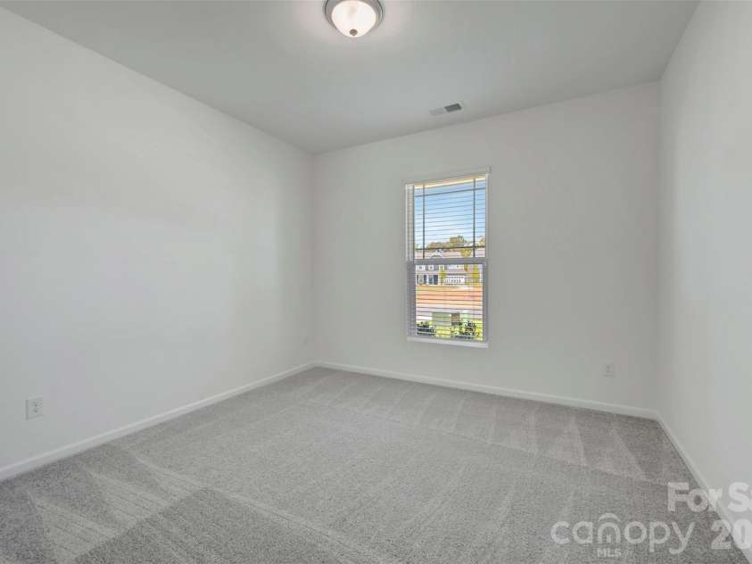 1410 Bucknell Street, Wingate, NC 28174.  MLS# CAR4429173, YatesRealty ID 53794. First floor bedroom
