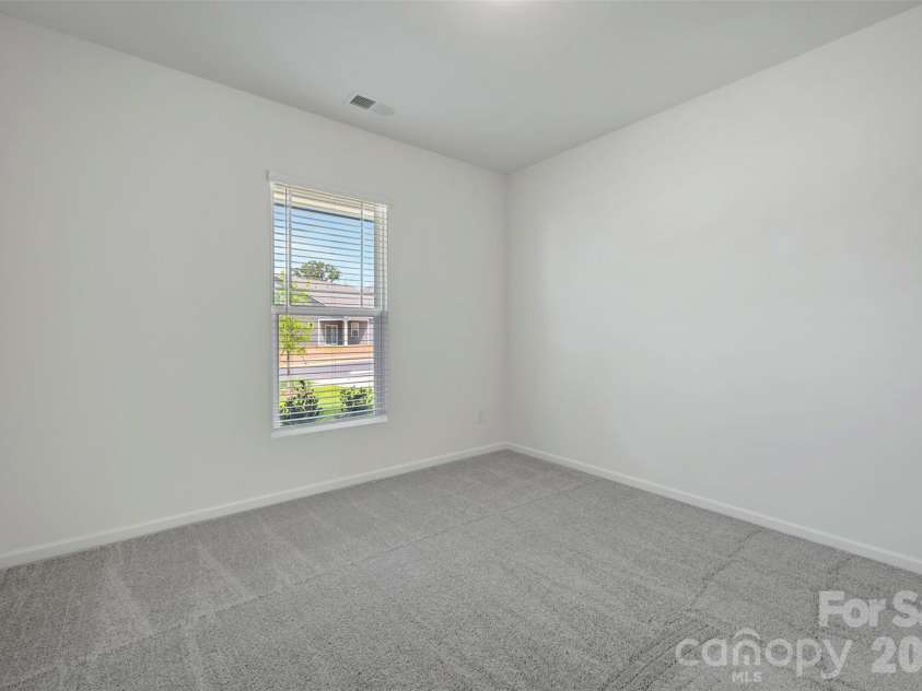 1410 Bucknell Street, Wingate, NC 28174.  MLS# CAR4429173, YatesRealty ID 53794. First floor bedroom