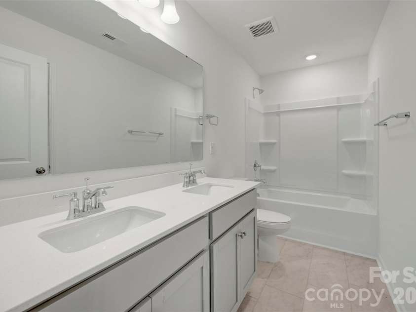 1410 Bucknell Street, Wingate, NC 28174.  MLS# CAR4429173, YatesRealty ID 53794. Secondary bathroom