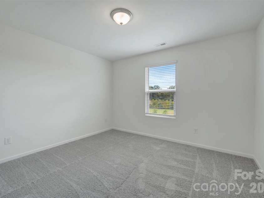 1410 Bucknell Street, Wingate, NC 28174.  MLS# CAR4429173, YatesRealty ID 53794. Secondary bedroom