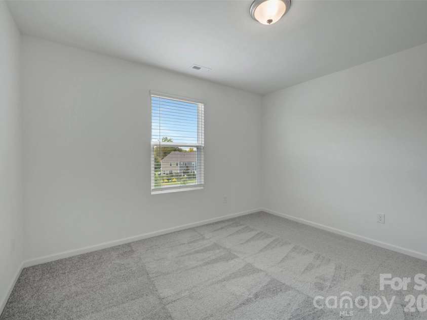 1410 Bucknell Street, Wingate, NC 28174.  MLS# CAR4429173, YatesRealty ID 53794. Secondary bedroom