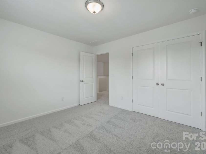 1410 Bucknell Street, Wingate, NC 28174.  MLS# CAR4429173, YatesRealty ID 53794. Secondary bedroom
