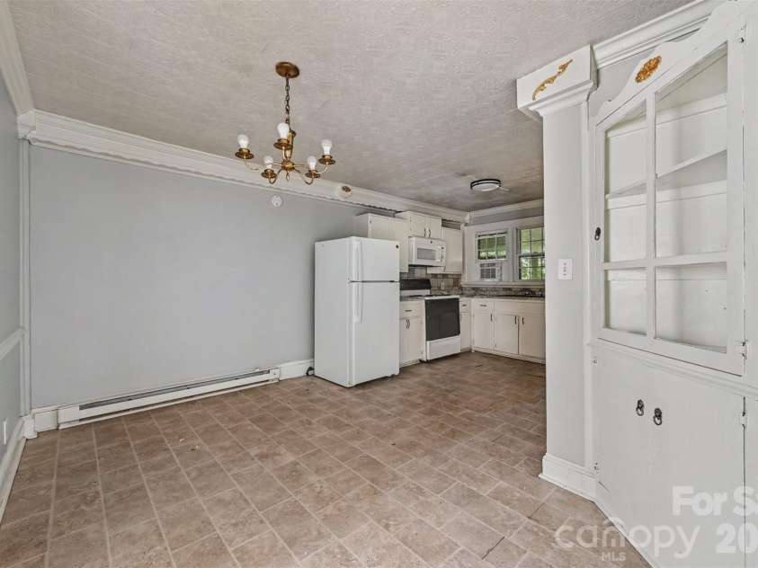 2547/2549 Pinckney Avenue, Charlotte, NC 28205.  MLS# CAR4429702, YatesRealty ID 53798. 2549 Dining Room into Kitchen