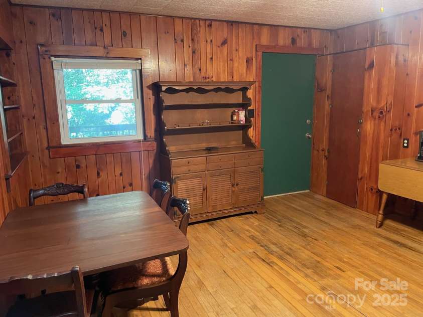 142 Whitewater Road, Sapphire, NC 28774.  MLS# CAR4229231, YatesRealty ID 538. Dining of second home and front door 