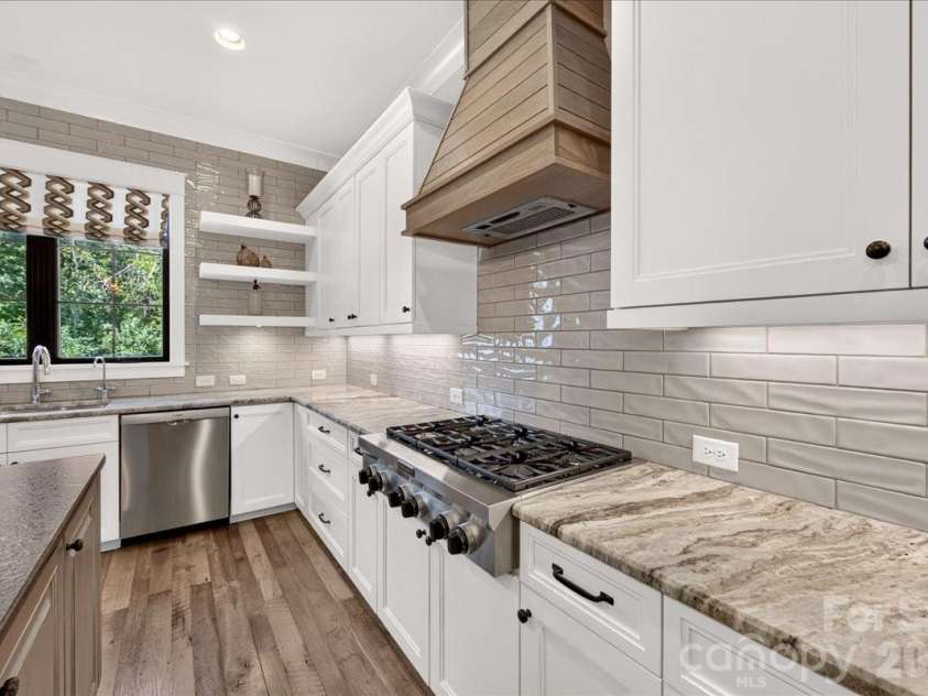416 Woodland Street, Davidson, NC 28036.  MLS# CAR4425891, YatesRealty ID 53849. Beautiful tile backsplash to the ceiling