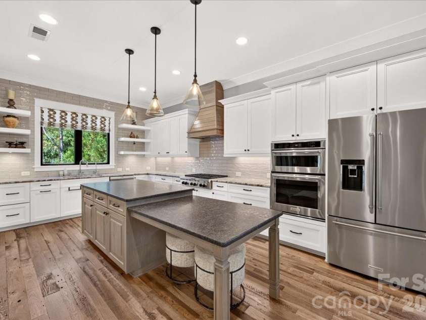 416 Woodland Street, Davidson, NC 28036.  MLS# CAR4425891, YatesRealty ID 53849. Gorgeous Kitchen with large tiered island with additional seating