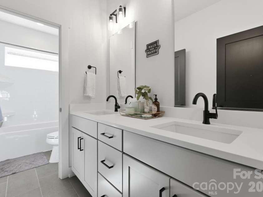 5212 Lynnville Avenue, Charlotte, NC 28205.  MLS# CAR4429076, YatesRealty ID 53877. Secondary bathroom