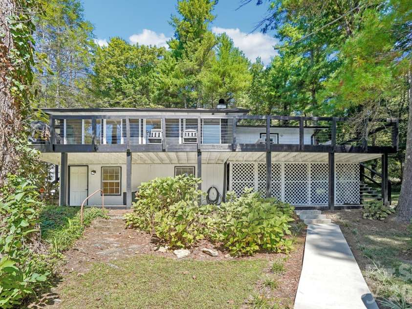 52 Lake Jordan Drive, Flat Rock, NC 28731.  MLS# CAR4425965, YatesRealty ID 53878. Back view of house