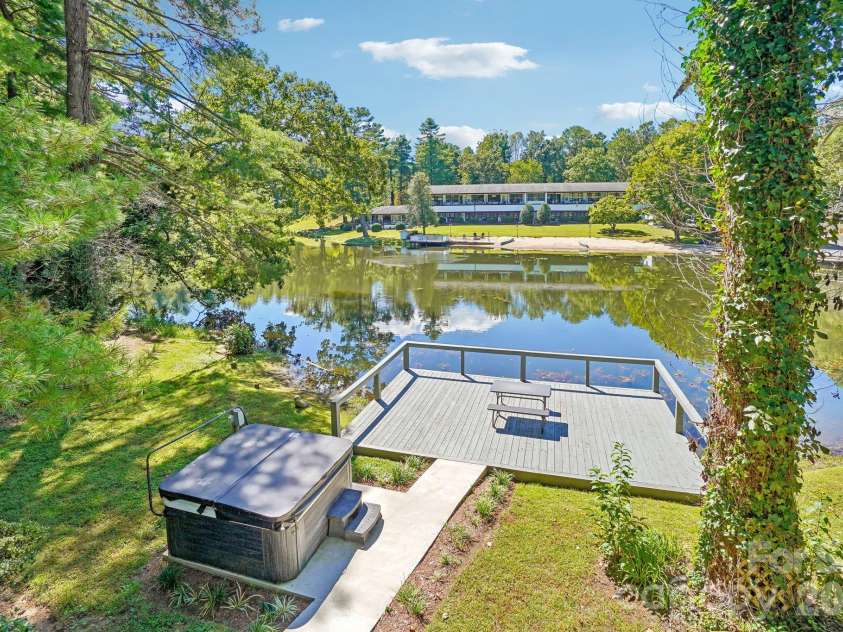 52 Lake Jordan Drive, Flat Rock, NC 28731.  MLS# CAR4425965, YatesRealty ID 53878. Large Dock and hot tub.