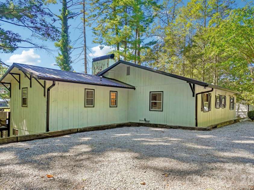 52 Lake Jordan Drive, Flat Rock, NC 28731.  MLS# CAR4425965, YatesRealty ID 53878. Side view and plenty of parking