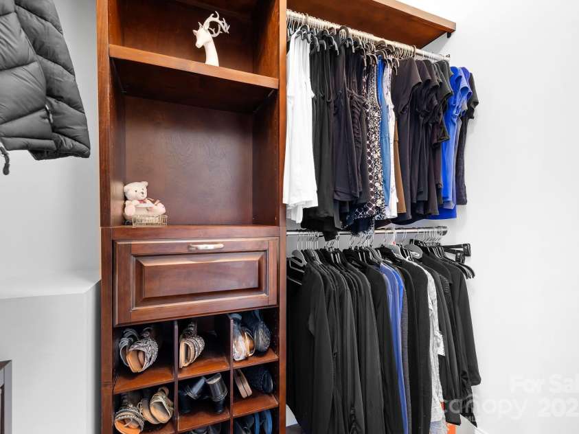 164 Crooked Branch Way, Troutman, NC 28166.  MLS# CAR4241614, YatesRealty ID 5388. His & Hers walk-in closets with built ins