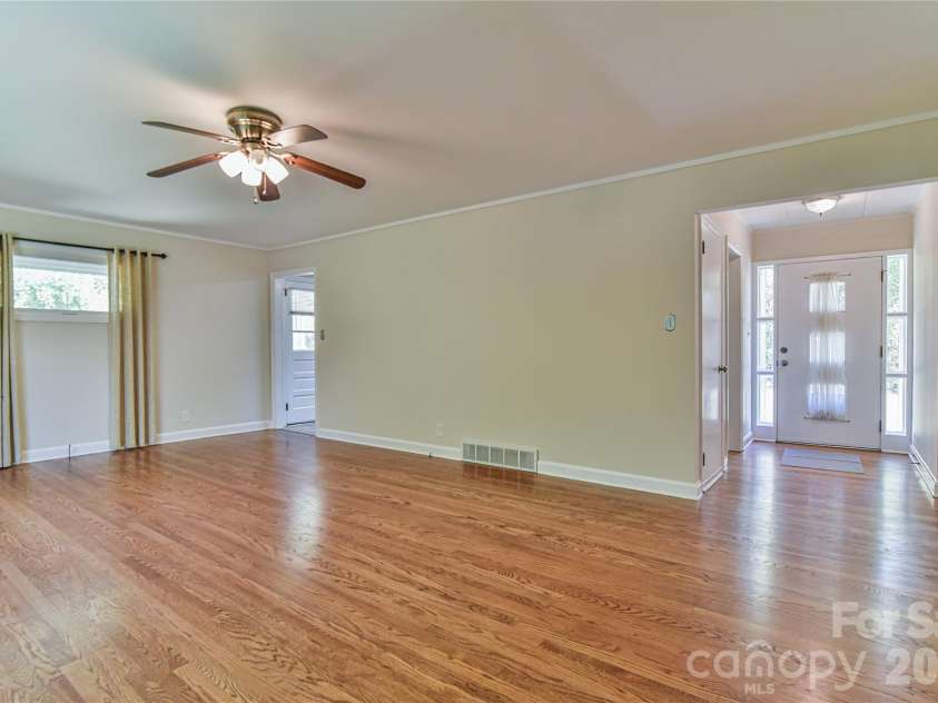 505 Monte Vista Road, Candler, NC 28715.  MLS# CAR4429414, YatesRealty ID 53896. Front Door into Living Room. Note the Beautiful Floors.