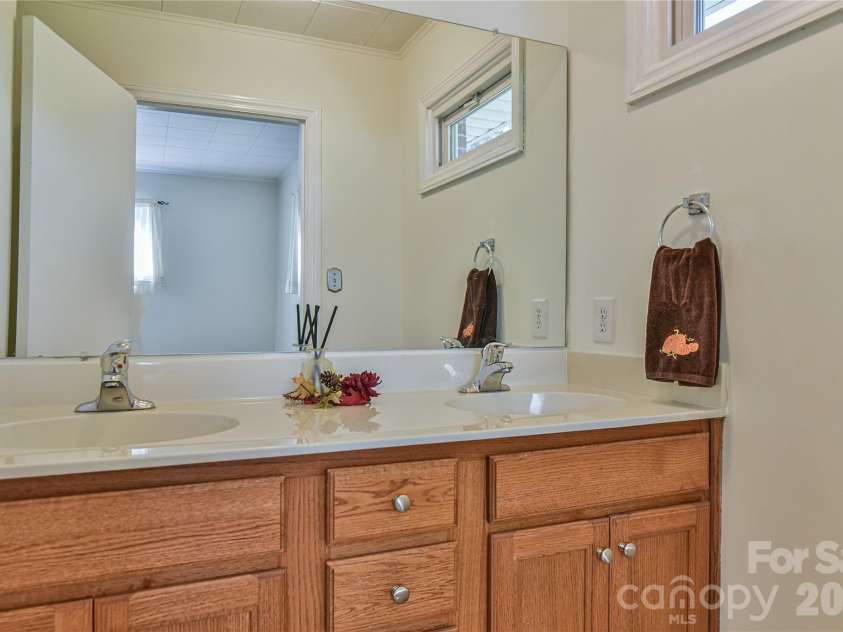 505 Monte Vista Road, Candler, NC 28715.  MLS# CAR4429414, YatesRealty ID 53896. Half Bath has Double Sinks.