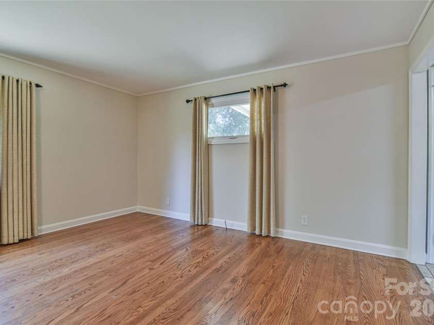 505 Monte Vista Road, Candler, NC 28715.  MLS# CAR4429414, YatesRealty ID 53896. The Large Living Room has Space for Dining as Well.