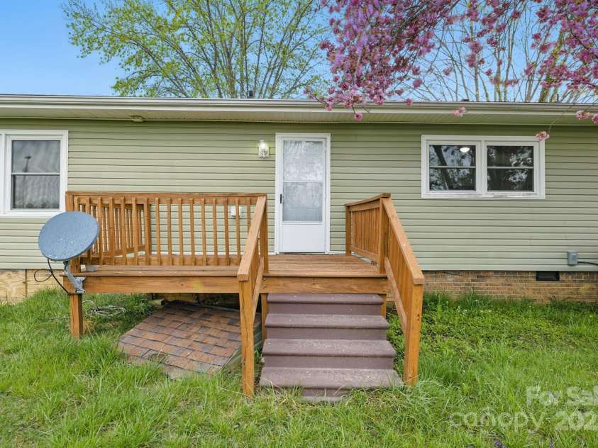 718 White Sparrow Drive, Hendersonville, NC 28792.  MLS# CAR4233485, YatesRealty ID 5392. Back of home