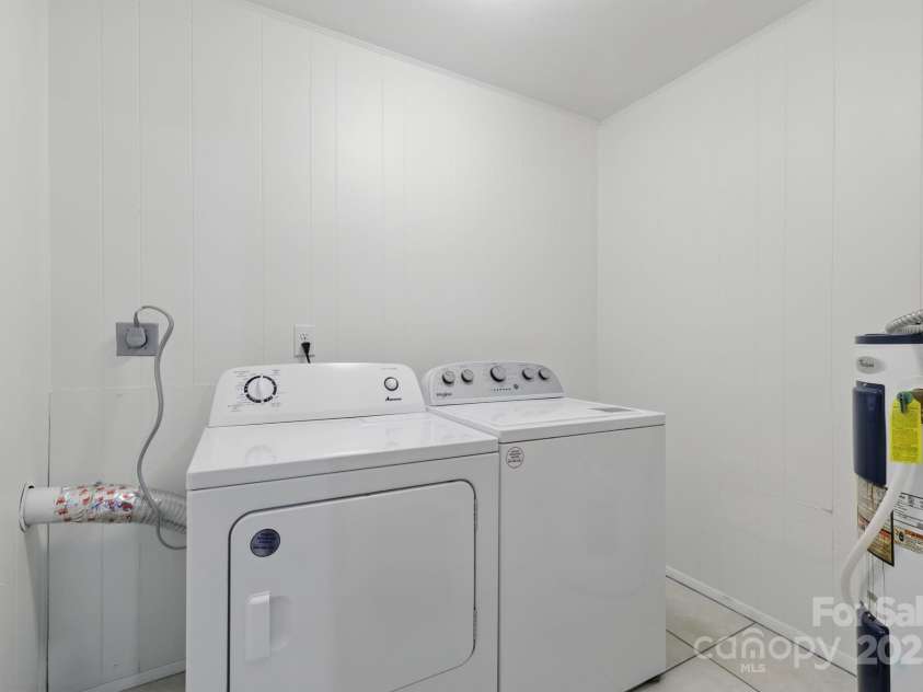 718 White Sparrow Drive, Hendersonville, NC 28792.  MLS# CAR4233485, YatesRealty ID 5392. Laundry room
