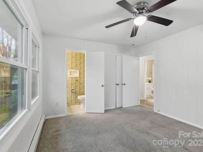 718 White Sparrow Drive, Hendersonville, NC 28792.  MLS# CAR4233485, YatesRealty ID 5392. Primary bedroom with half bath