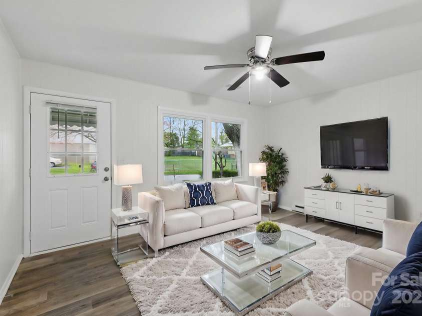 718 White Sparrow Drive, Hendersonville, NC 28792.  MLS# CAR4233485, YatesRealty ID 5392. Virtually staged living room