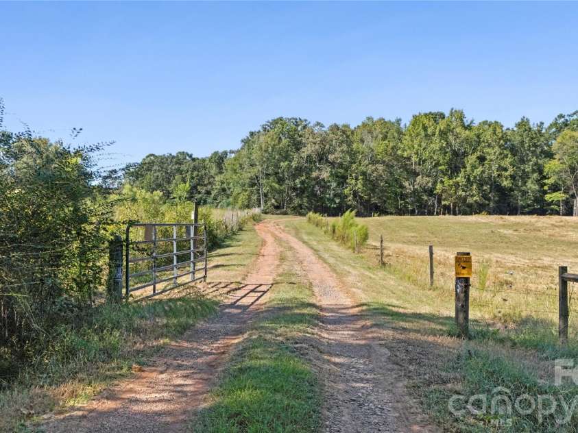 3627 Edwards Road, Wingate, NC 28174.  MLS# CAR4427215, YatesRealty ID 53920. Long, private driveway