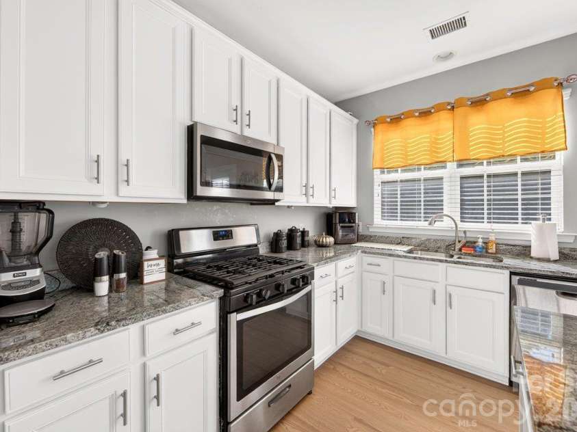 10536 Adlin Avenue, Charlotte, NC 28262.  MLS# CAR4429740, YatesRealty ID 53922. Kitchen has recently upgraded granite countertops.