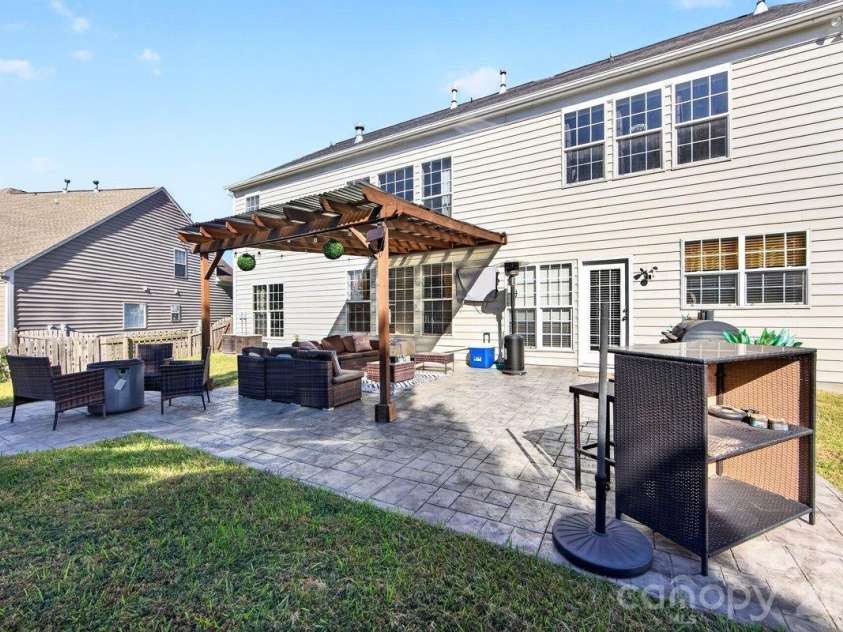 10536 Adlin Avenue, Charlotte, NC 28262.  MLS# CAR4429740, YatesRealty ID 53922. Nice stamped concrete patio