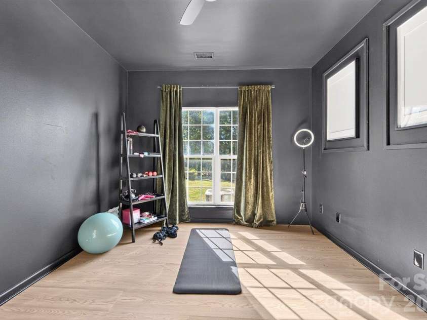 10536 Adlin Avenue, Charlotte, NC 28262.  MLS# CAR4429740, YatesRealty ID 53922. Office that is currently being used as a workout room