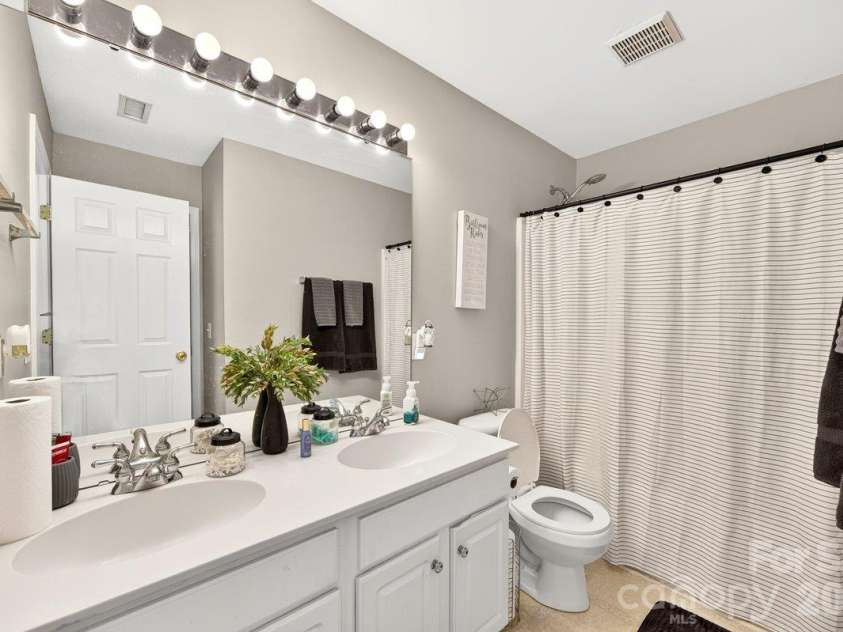 10536 Adlin Avenue, Charlotte, NC 28262.  MLS# CAR4429740, YatesRealty ID 53922. Upstairs guest bathroom