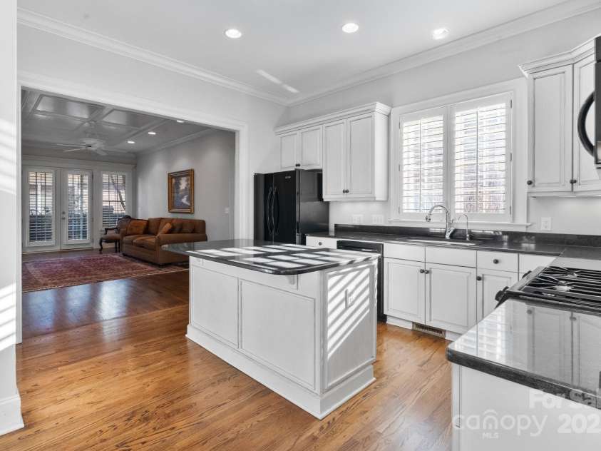 1131 Kings Drive, Charlotte, NC 28207.  MLS# CAR4235522, YatesRealty ID 5393. The Kitchen is next to the Family Room so the Chef can stay in the conversation.
