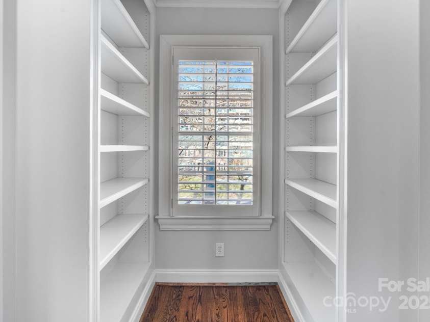 1131 Kings Drive, Charlotte, NC 28207.  MLS# CAR4235522, YatesRealty ID 5393. Upstairs hallway built-in bookcases.