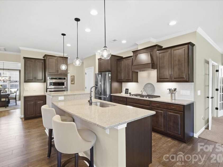 445 Haven Avenue, Fort Mill, SC 29715.  MLS# CAR4428956, YatesRealty ID 53954. Kitchen w/island & pendant lights