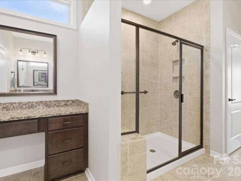 445 Haven Avenue, Fort Mill, SC 29715.  MLS# CAR4428956, YatesRealty ID 53954. Primary bath w/tile shower & dressing table