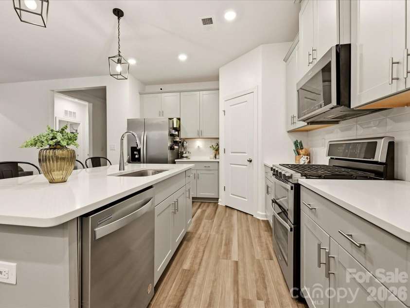 7715 Porrera Street, Charlotte, NC 28214.  MLS# CAR4428468, YatesRealty ID 53964. Kitchen Flow
