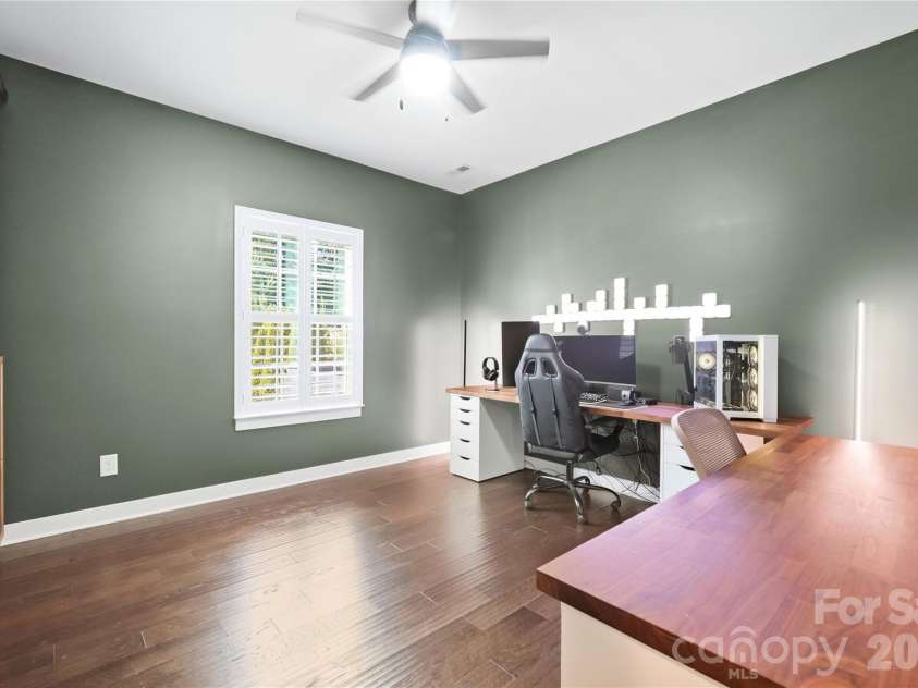 912 Manorwood Drive, Waxhaw, NC 28173.  MLS# CAR4427277, YatesRealty ID 53979. Flexible main-level study with plantation shutters and a ceiling fan, ready to work as a second home office, guest space, or workout room.