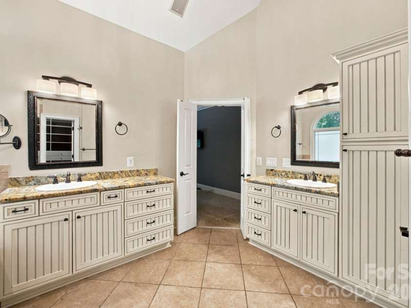 7481 Brotherton Road, Denver, NC 28037.  MLS# CAR4427523, YatesRealty ID 53983. Custom cabinets and grantite counters in primary bath