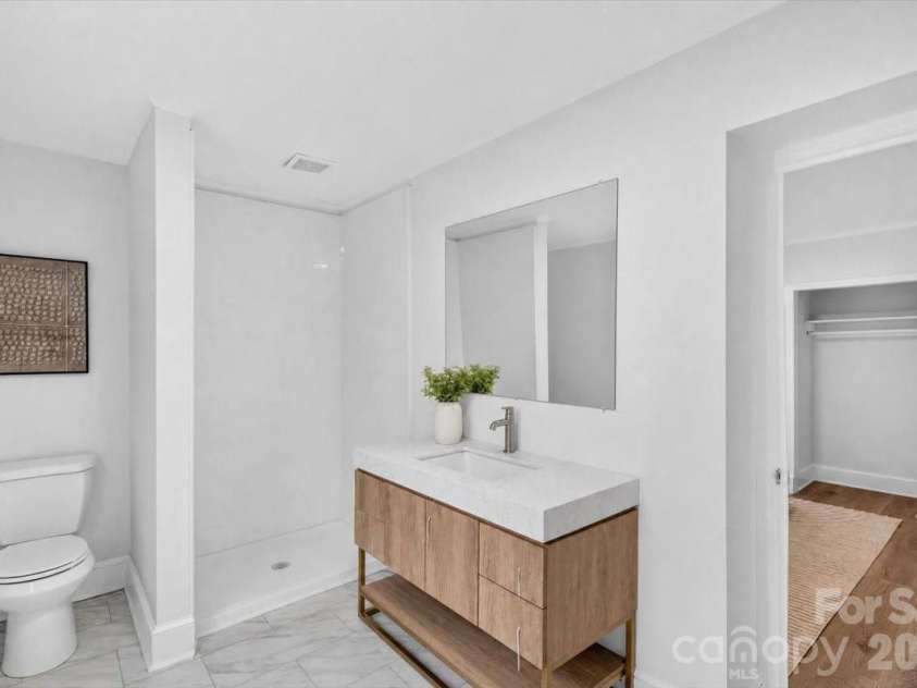 2048 Simmons Street, Gastonia, NC 28052.  MLS# CAR4427061, YatesRealty ID 53987. Primary bath w/ lux vanity and oversized shower