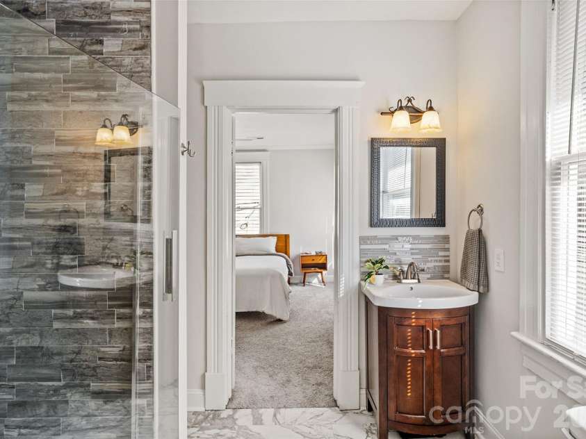 233 Marion Street, Rock Hill, SC 29730.  MLS# CAR4415460, YatesRealty ID 54008. Natural light brightens the primary ensuite