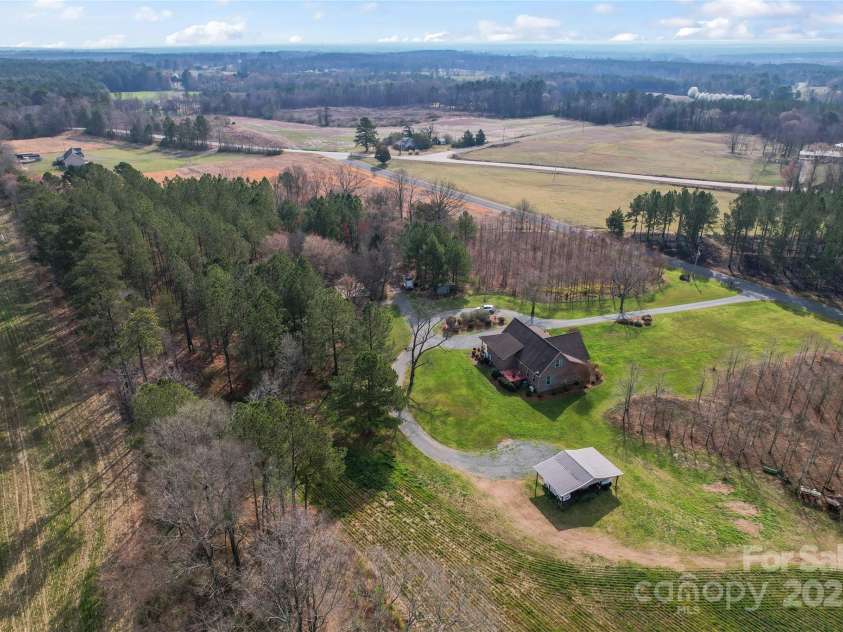 158 White Road, Wadesboro, NC 28170.  MLS# CAR4207343, YatesRealty ID 5401. Aerial view from back of home.