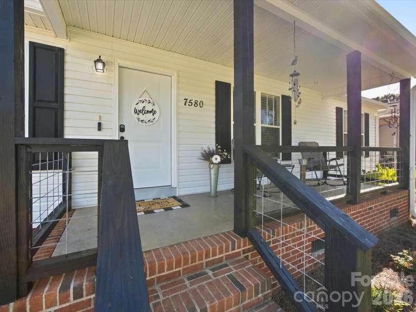 7580 Woodleaf Road, Woodleaf, NC 27054.  MLS# CAR4427833, YatesRealty ID 54012. Covered front porch