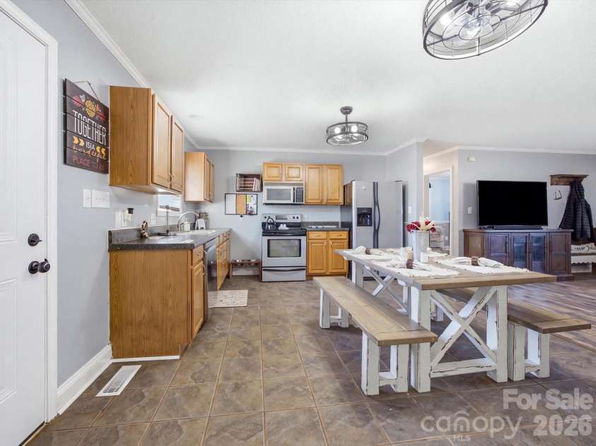 7580 Woodleaf Road, Woodleaf, NC 27054.  MLS# CAR4427833, YatesRealty ID 54012. Dining area and kitchen