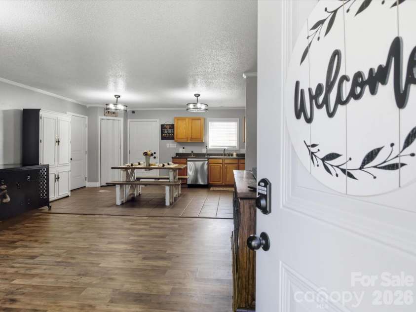 7580 Woodleaf Road, Woodleaf, NC 27054.  MLS# CAR4427833, YatesRealty ID 54012. Entry way into open floor plan with living area and kitchen