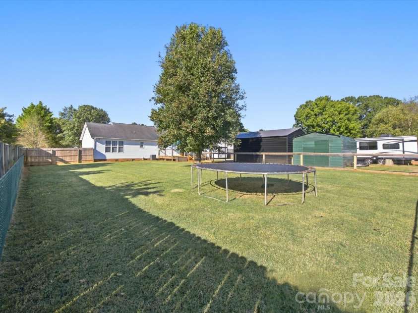 7580 Woodleaf Road, Woodleaf, NC 27054.  MLS# CAR4427833, YatesRealty ID 54012. Fenced back yard