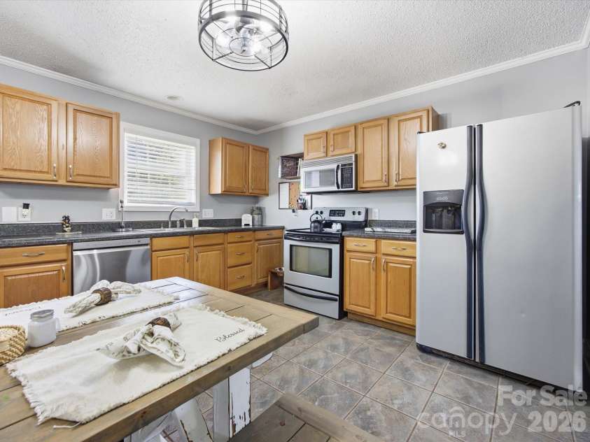 7580 Woodleaf Road, Woodleaf, NC 27054.  MLS# CAR4427833, YatesRealty ID 54012. Kitchen with plenty of counter space