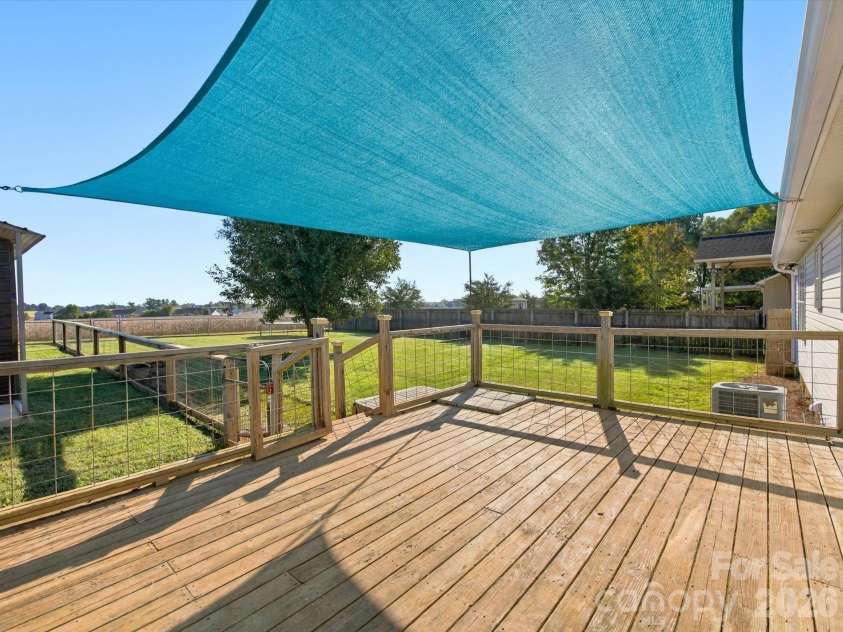 7580 Woodleaf Road, Woodleaf, NC 27054.  MLS# CAR4427833, YatesRealty ID 54012. Large back deck overlooks fenced back yard