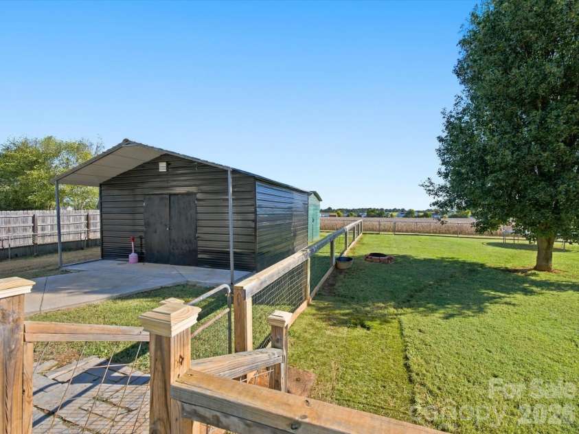 7580 Woodleaf Road, Woodleaf, NC 27054.  MLS# CAR4427833, YatesRealty ID 54012. Large detached garage